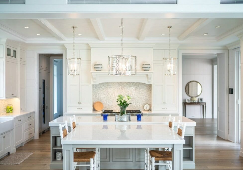 Spectacular custom kitchen in white inset cabinetry with custom hood focal point.